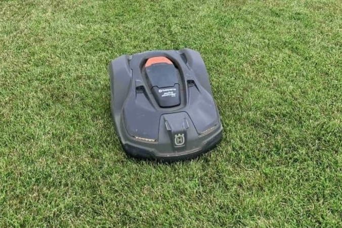 Image of a Husqvarna lawn power mowing a lawn