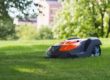 Image of a Husqvarna Automower mowing the lawn.