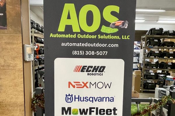 A shop sign for Automated Outdoor Solutions (AOS)