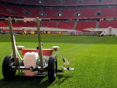 A SWOZI sports field line marker at work