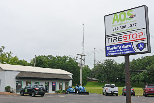 Picture of the storefront and billboard of an automatic lawn mower company