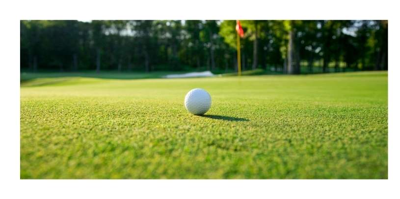 Golf Course Golf Green Mower Golf course with close up of golf ball