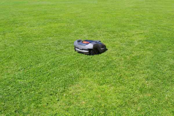 Robot fairway mower providing clean cut grass on a golf course.