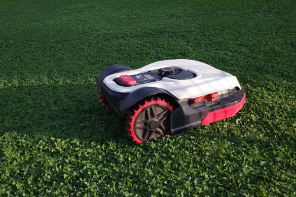 Photo of a Sunseeker Robot Mower cutting the lawn of a residential home